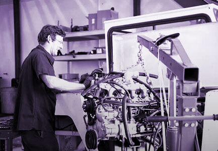 Employee Repairs Engine